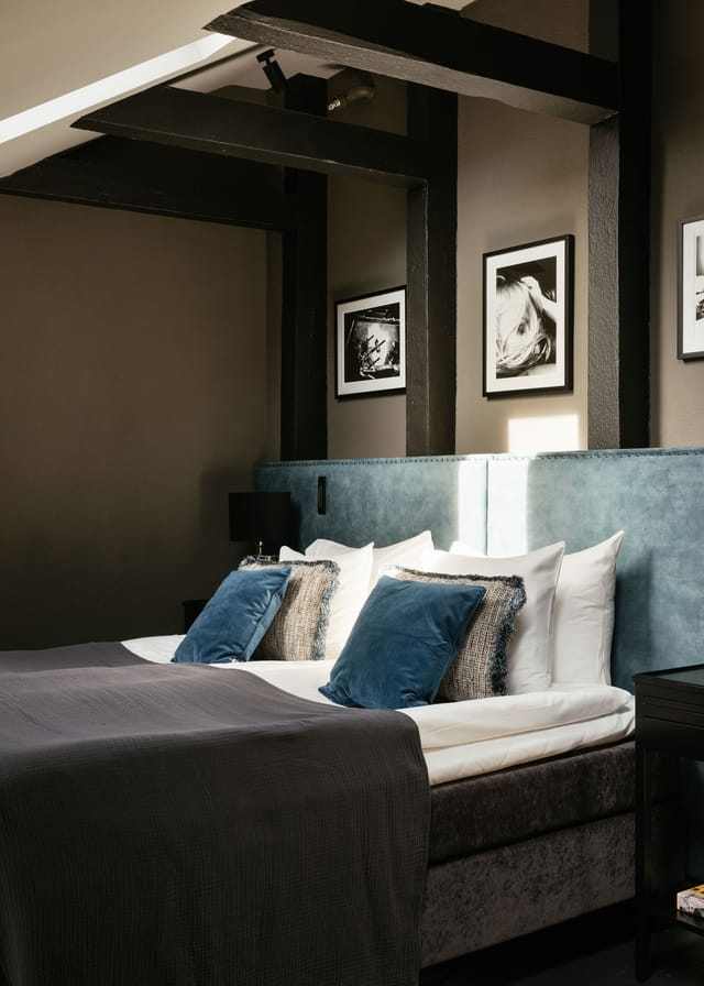 Luxury boutique hotel suite for VIP speakers and incentive travel, featuring sophisticated textures.