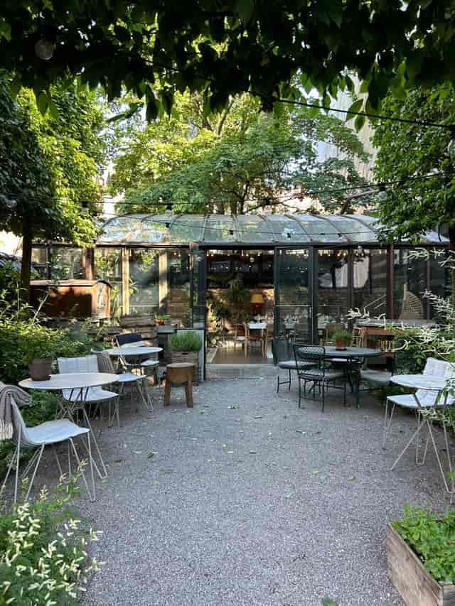 Greenhouse garden setting for intimate outdoor receptions and small event breakout sessions.