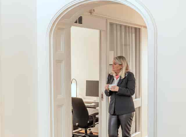 Private desk in a quiet breakout space for executive consultations and corporate events.