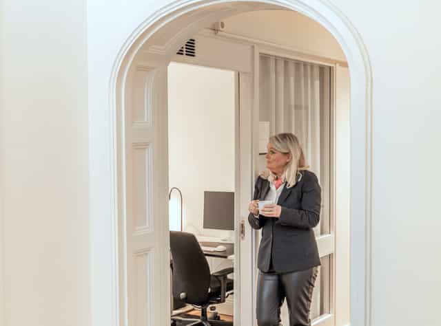 Private desk in a quiet breakout space for executive consultations and corporate events.