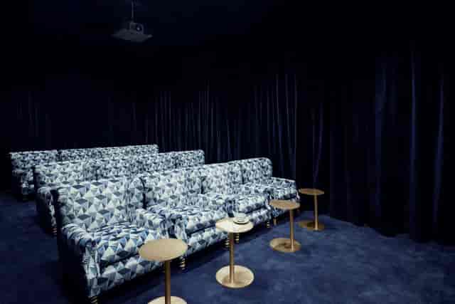 Origo Cinema: Plush armchairs in a luxury screening room for private workshops and film events.