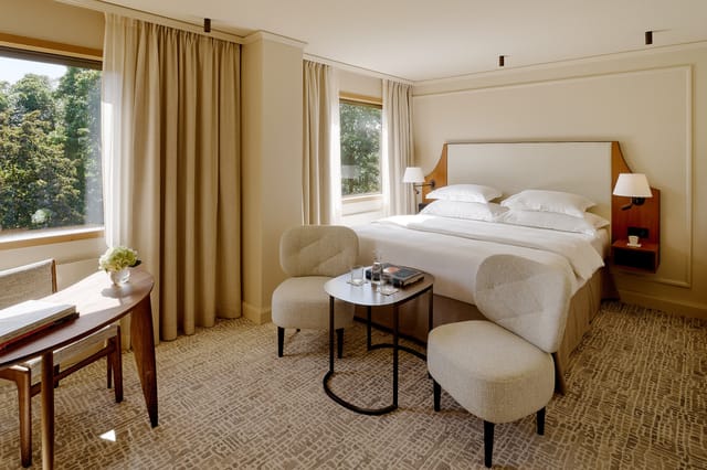 VIP executive guestroom with workspace at Villa Dahlia for luxury business travel.