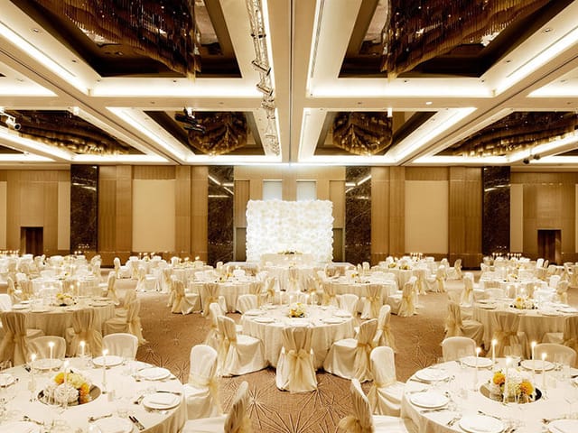 Nizami Ganjavi Grand Ballroom in Fairmont Baku with floral wall for corporate galas and weddings.