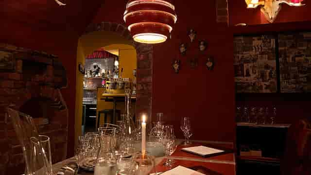 Vinous Courtyard Restaurant: intimate, moody decor for private dining and corporate events.