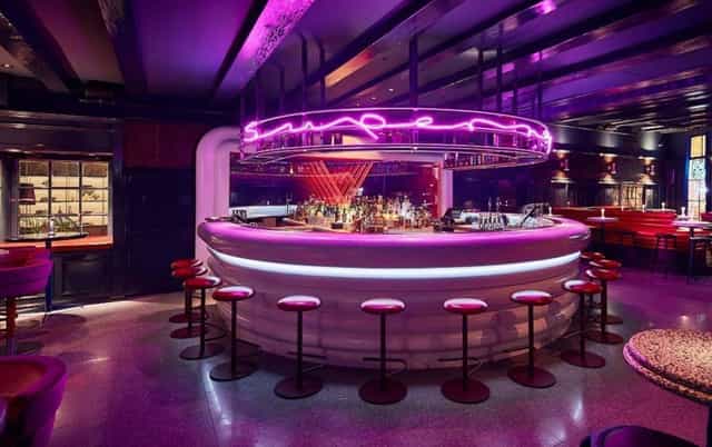 Chic circular bar at Super Lyan, ideal for cocktail receptions and networking events.
