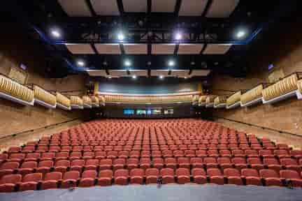 Millennium Theatre auditorium with tiered seating, ideal for conferences and presentations.