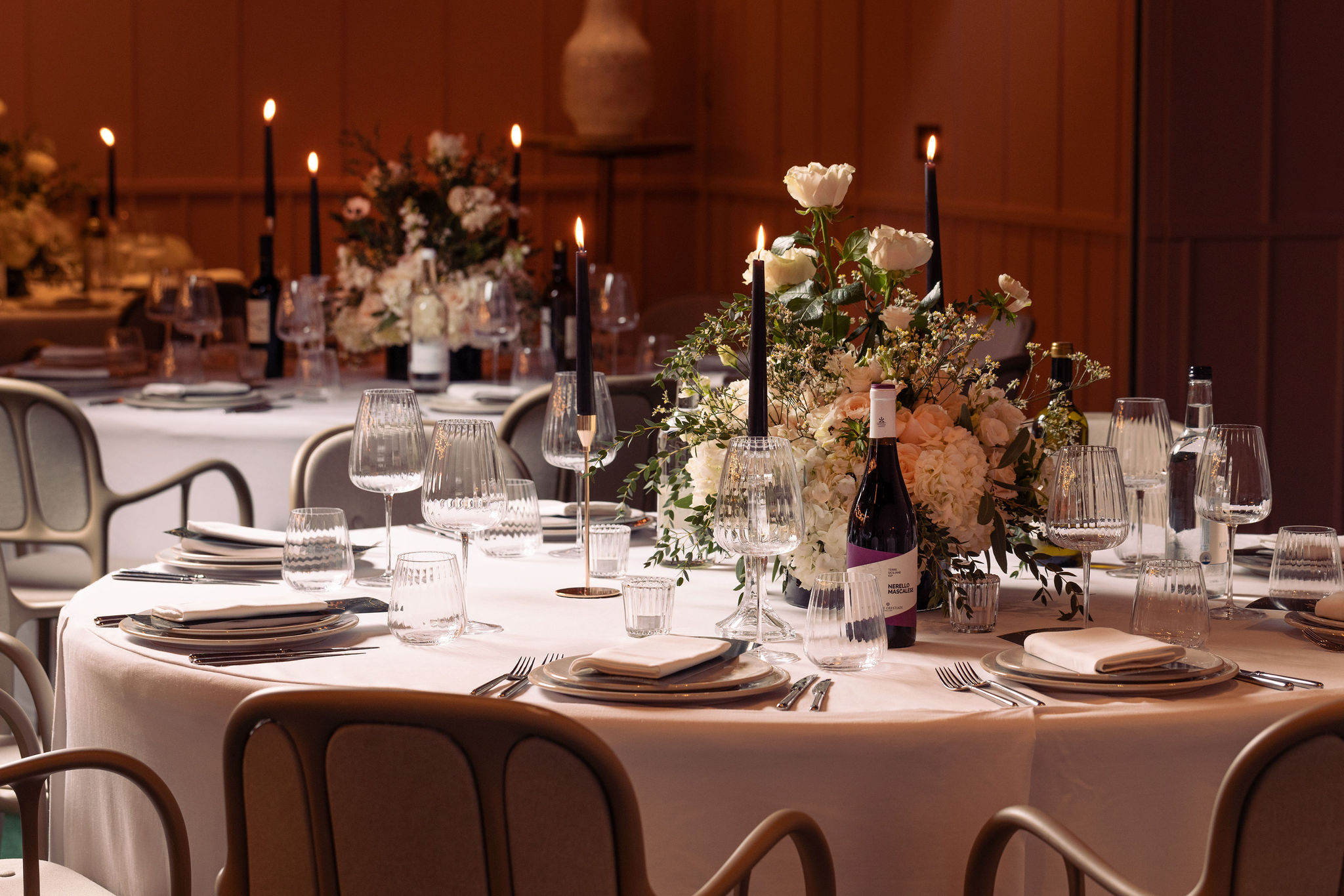 Elegant dining table with floral centerpieces for upscale events at art'otel London. - Banner