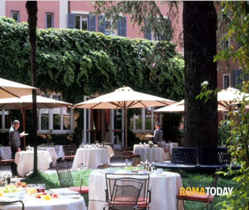 Elegant outdoor restaurant terrace for corporate networking and luxury luncheon events.