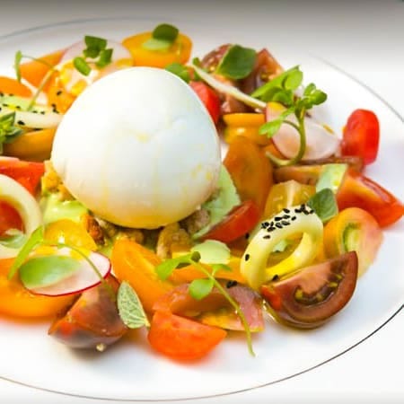 Burrata salad at Salone Eva restaurant, perfect for premium banquet or upscale networking catering.