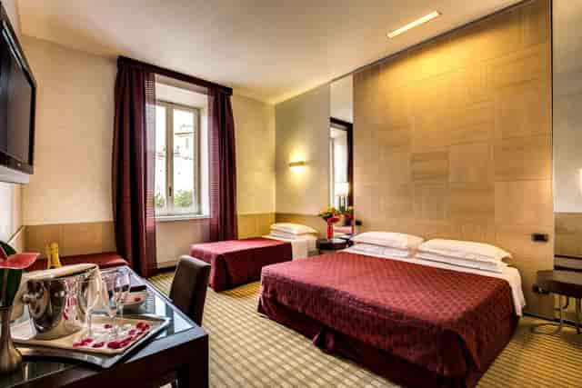 Modern twin guest suite at Kolbe Hotel Rome for conference business travel.