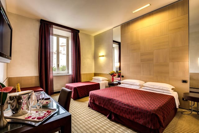 Modern twin guest suite at Kolbe Hotel Rome for conference business travel.