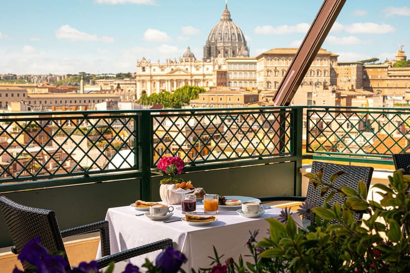 VIP breakfast setup at Michelangelo Room, Terrazza Les Etoiles with St. Peter’s Basilica view.