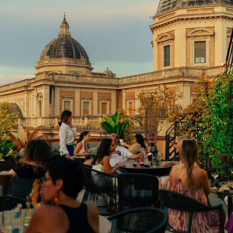 Professional rooftop networking reception at historic Masa landmark.