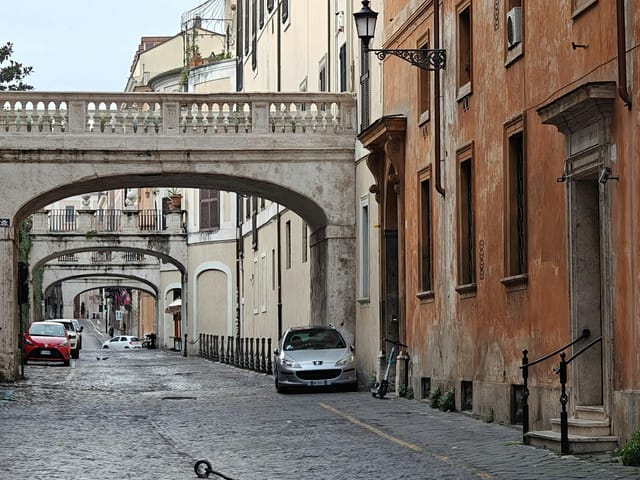 Roma Eventi Fontana di Trevi meeting rooms on a narrow Italian street for corporate event venues.