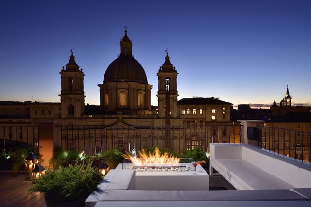 Luxury rooftop corporate reception venue with historic Rome backdrop for incentive events.