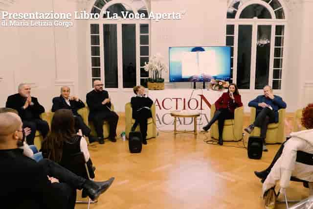 Circular panel discussion setup at Royal Space Rome for professional book presentation event.