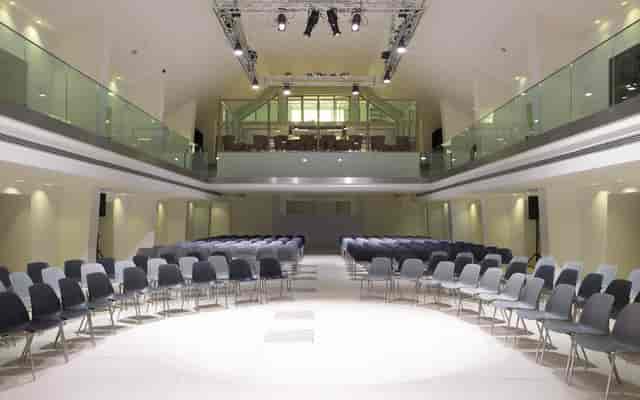 Modern theater-style conference room in Rome for product launches and corporate keynote events.