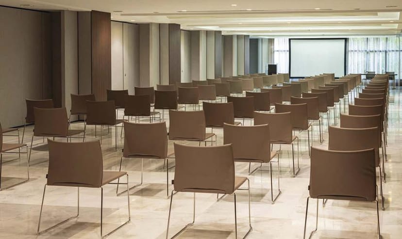Theater-style setup at Centro Congressi Cavour for corporate presentations and training seminars.