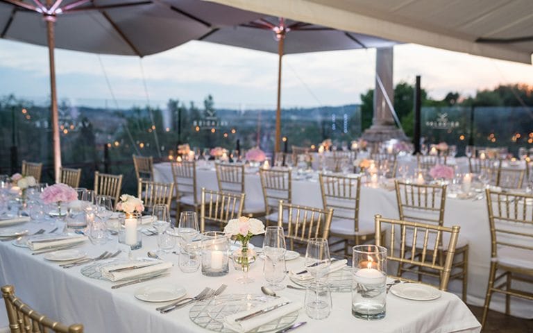 Terrace dining at Sala degli Specchi, Casina Valadier with gold chairs for luxury wedding events.