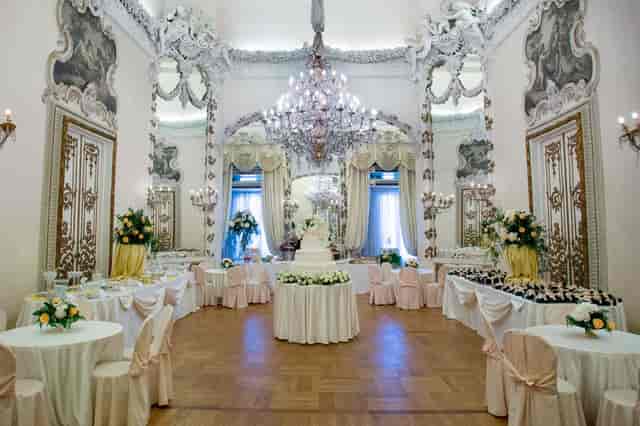 Sala delle Vestali ballroom with crystal chandeliers for a formal wedding reception.