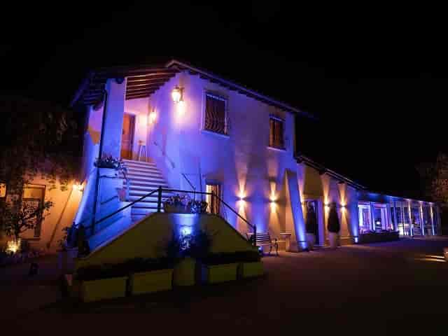 Party planner at Villa Vittoria with dramatic up-lighting for evening reception and gala events.
