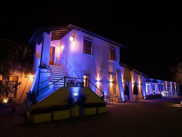 Party planner at Villa Vittoria with dramatic up-lighting for evening reception and gala events.