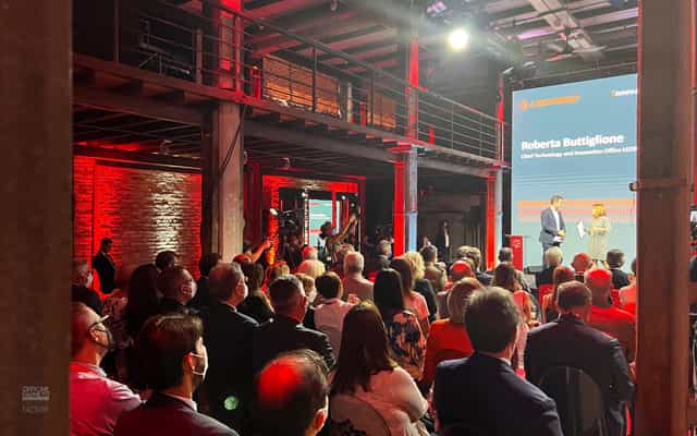 Officine Farneto conference center with red uplighting for tech-forward corporate keynote events.