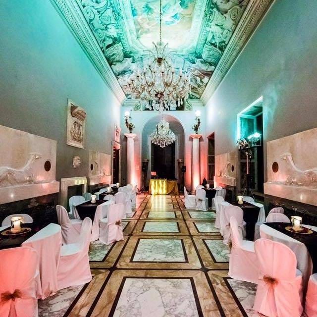 Historic Villa Brasini ballroom with dramatic lighting for luxury event venue and corporate gala.