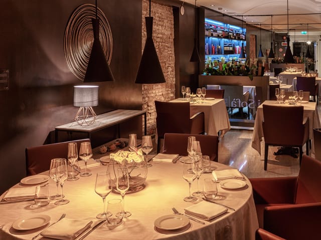 Sophisticated Hotel Indigo Rome suite set for high-end corporate dinner and VIP reception.