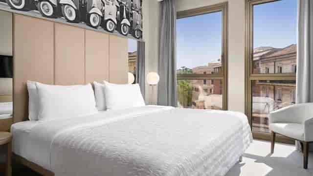 Modern guest room at Le Méridien Visconti Rome, perfect for business travel and corporate stays.