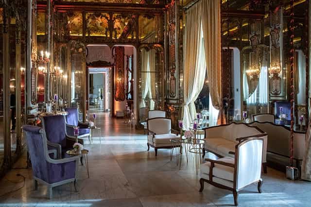 Salone degli Specchi mirrored executive meeting room for high-end corporate events.