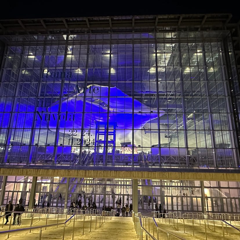 Roma Convention Center La Nuvola with blue lighting for corporate event and conference branding.