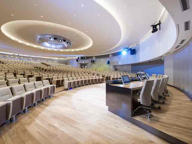 Sala Accademia auditorium with tiered seating for executive keynotes and academic symposia.