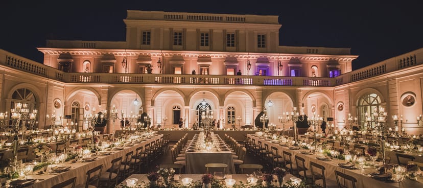 Elegant outdoor gala dinner at Villa Miani with long tables and refined lighting for luxury events.