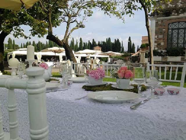 Villa dei Cesari outdoor dining setup for upscale wedding reception and luxury event venue.