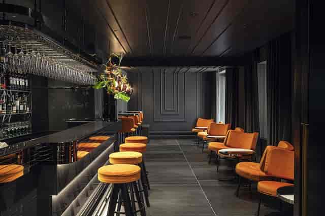 Moodily lit bar at Hotel Orazio Palace, perfect for VIP receptions and upscale networking events.