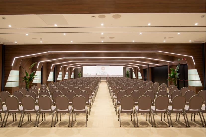 Modern Hotel Shangri-La Roma ballroom in theater setup for corporate presentations and conferences.