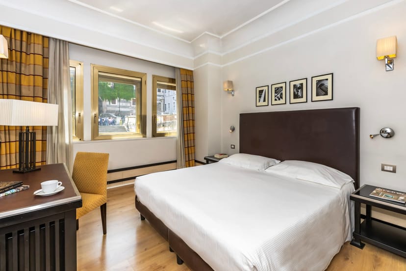 Grand Hotel Palatino guest room with workspace for business travel and corporate accommodation.