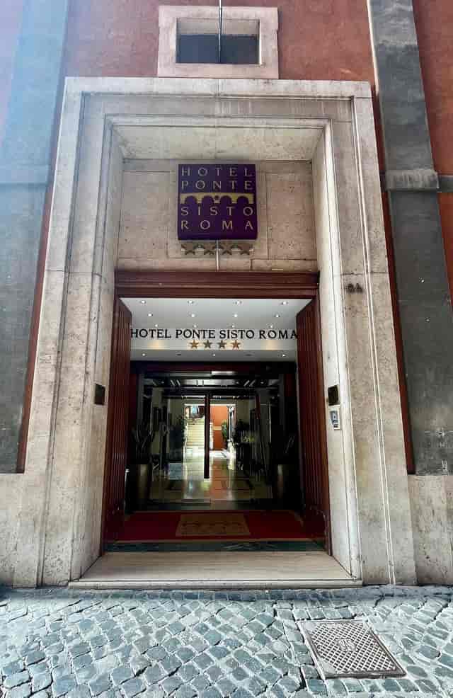 Hotel Ponte Sisto business center entrance, classic Italian corporate event space in Rome.