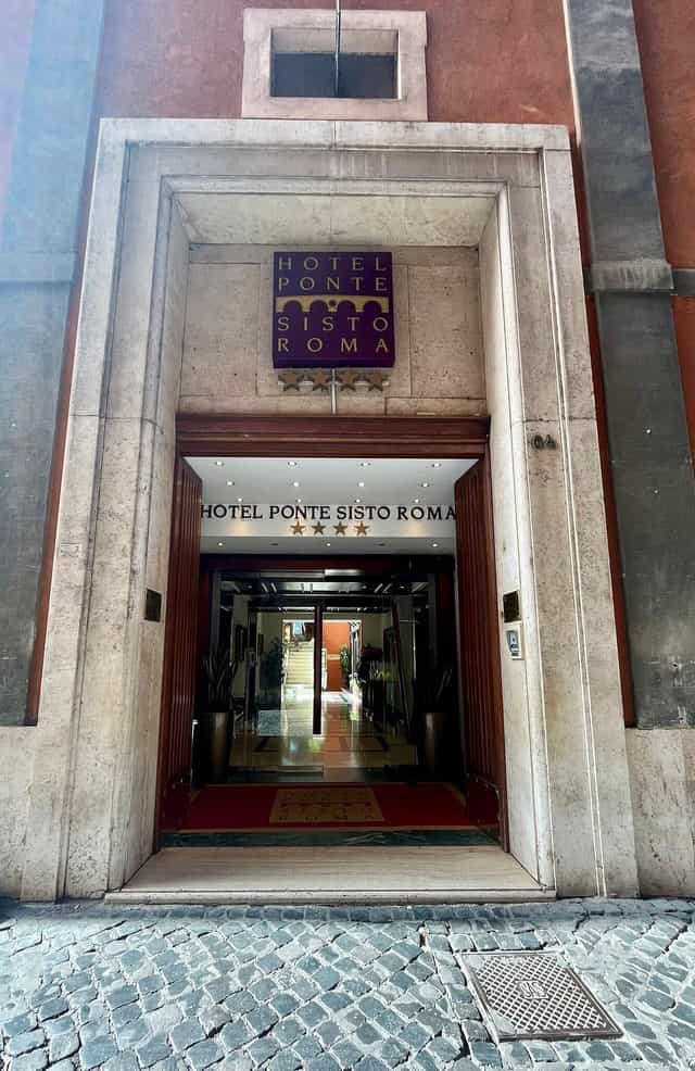 Hotel Ponte Sisto business center entrance, classic Italian corporate event space in Rome.