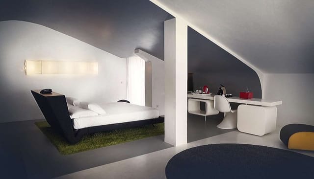 Modern loft-style hotel room at Suites in Ripa Roma for boutique business travel and VIP events.