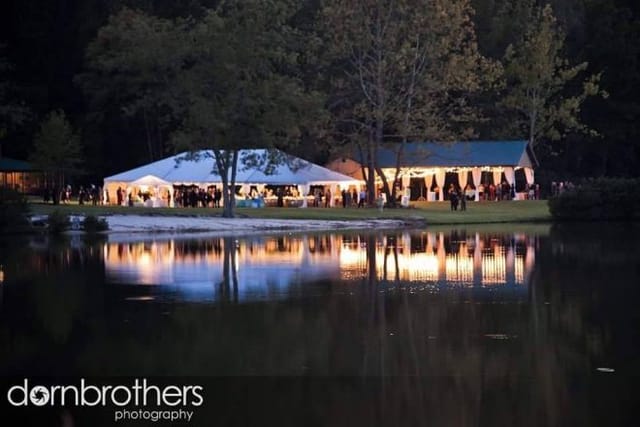 The Lakehouse at Taylor Estate with ambient lighting for lakeside evening wedding receptions.