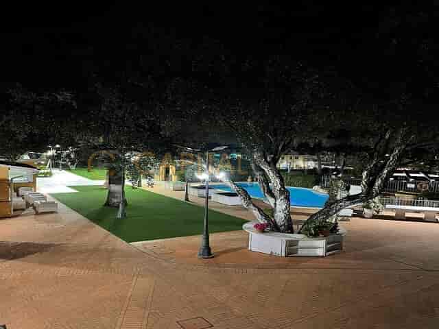Mediterranean garden venue with poolside lighting for evening wedding cocktail receptions.