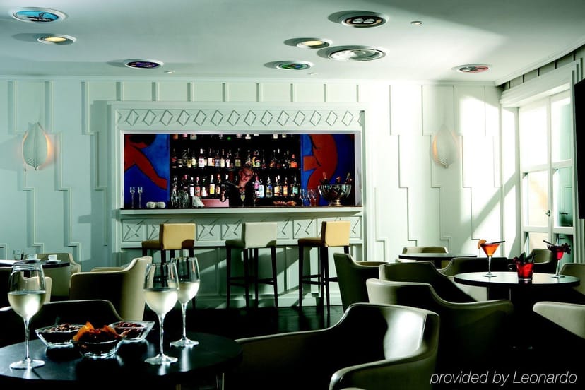 Modern hotel bar with lounge seating for upscale cocktail receptions and networking events.