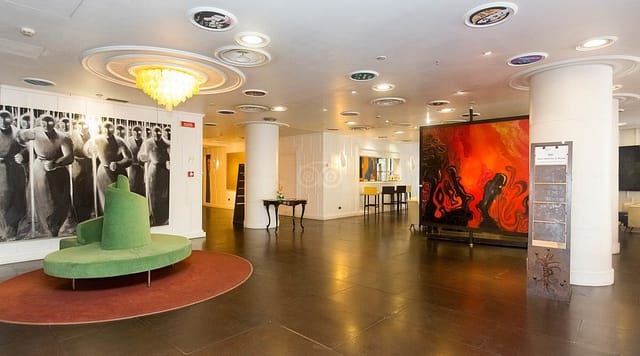 Modern hotel bar for networking event, featuring contemporary lounge seating and branding space.