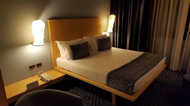 Modern Hotel Abitart suite with workspace for corporate room blocks and business travel.