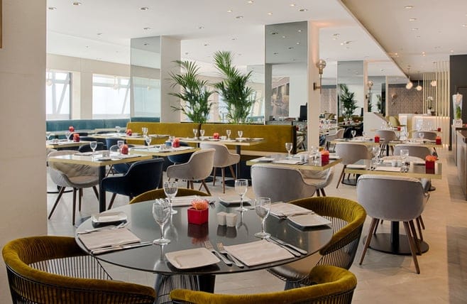 Modern restaurant with modular seating for corporate luncheons and upscale event dining in Rome.