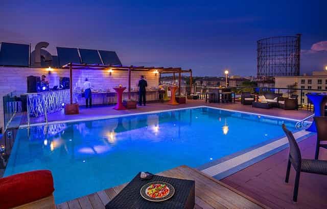 H10 Roma Città rooftop terrace with pool, perfect for upscale cocktail receptions and mixers.