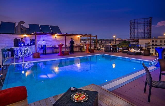 H10 Roma Città rooftop terrace with pool, perfect for upscale cocktail receptions and mixers.