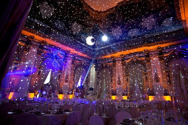 Ballroom in Brancaccio Palace with pin-spotting lighting for an evening gala event.